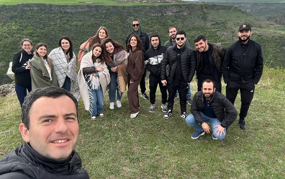 The Hundred MS team on a hike in green hills