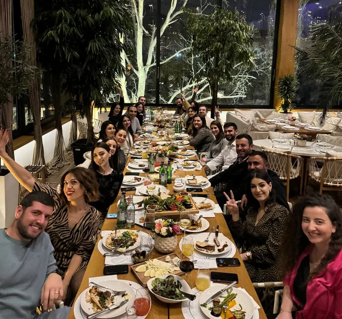 The Hundred MS team at a long dinner table