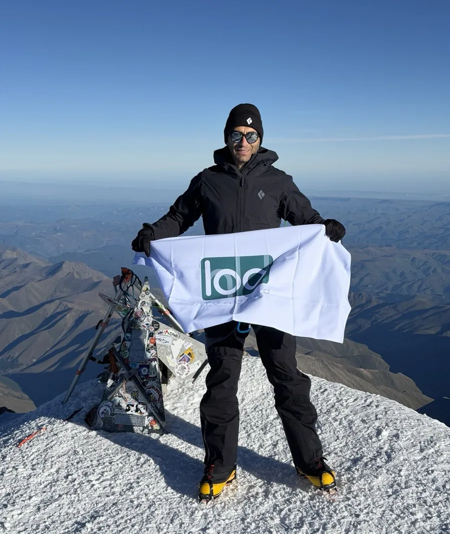 Narek Abgaryan holding the Hundred flag on the highest summit in Europe